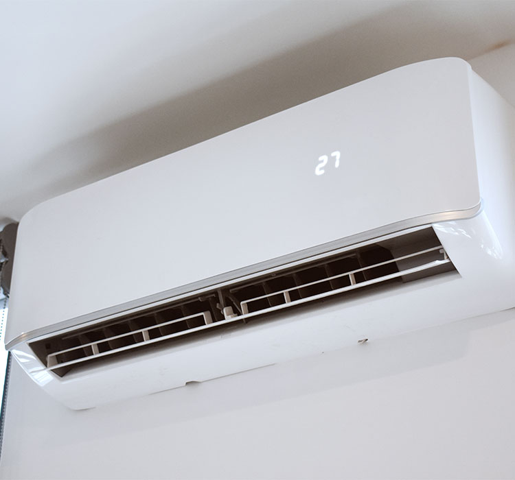 Air conditioning unit on bedroom wall